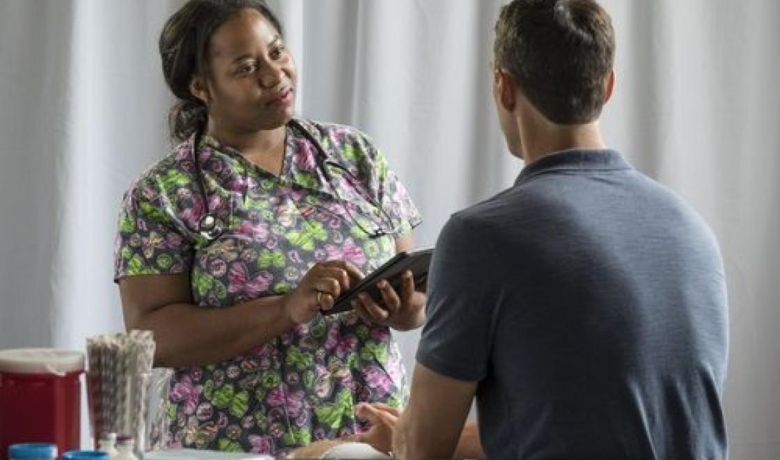 Mental health nurse with patient