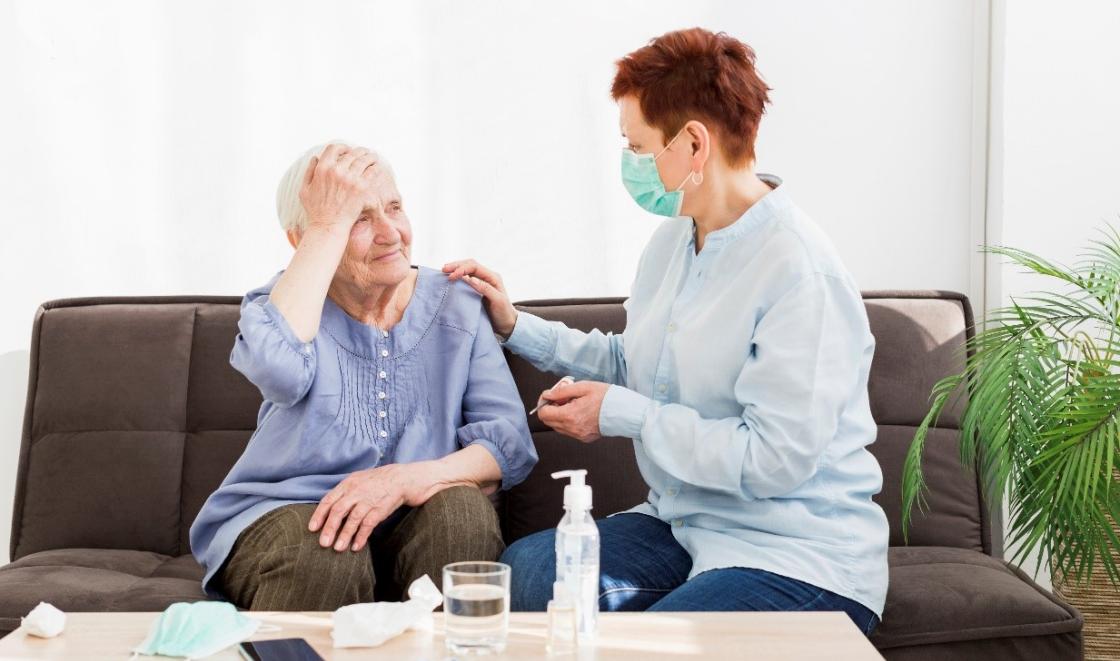 Old woman with personal assistant