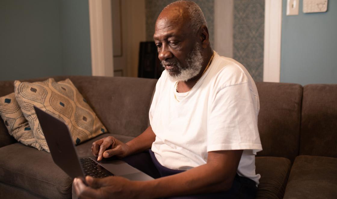 Black man on laptop. Photo by Tolu Bamwo