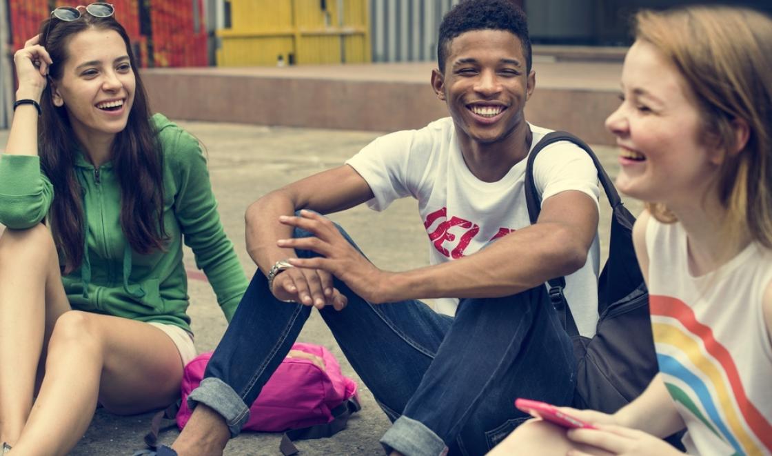 Stock image of young people socialising